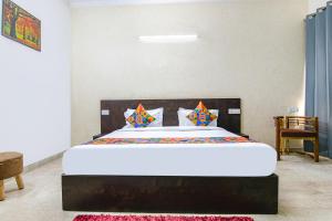 a bedroom with a large bed in a room at FabHotel Water Vibe in Gurgaon