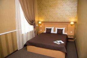 Postel nebo postele na pokoji v ubytování Dvoryanskiy Hotel