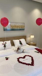 Voodi või voodid majutusasutuse شاليهات المرفأ Almarfa Resort toas