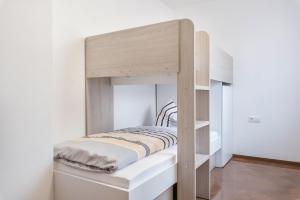 Postel nebo postele na pokoji v ubytování Trojer Apartment 1