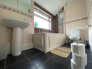 a bathroom with a sink and a toilet at Nice Living Serviced Accommodations 5 in Coventry