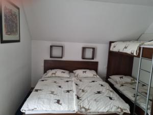 a bedroom with two bunk beds in it at Holiday Mountain House Rupicapra in Kostel