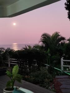 a view of the ocean at sunset from a house at Tahiti Umdloti in Umdloti