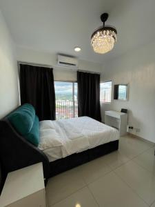 a bedroom with a bed and a large window at Premium Service Appartment in Seri Kembangan