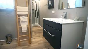 a bathroom with a sink and a mirror at Baia di Luna in Santa Marinella