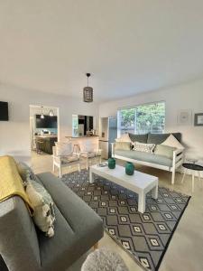 a living room with a couch and a table at Living The Breede-Lorigan House in Malgas