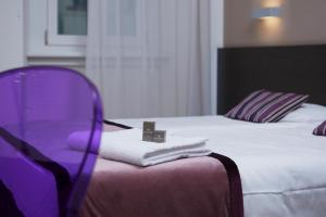 Postel nebo postele na pokoji v ubytování Hotel Centrale