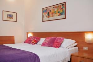 Postel nebo postele na pokoji v ubytování Hotel Centrale