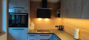 A kitchen or kitchenette at Appartement Waldzauber