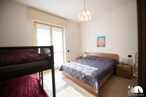 Posteľ alebo postele v izbe v ubytovaní Central Suite Moniga