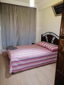 Postel nebo postele na pokoji v ubytování Mohammed V Airport Appartment
