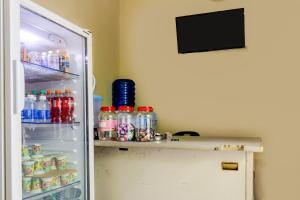 a refrigerator filled with lots of food and drinks at OYO 92322 Hasan House Syariah in Nagoya