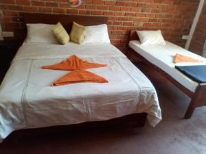 a bed with two stars on top of it at Nimsara Homestay in Ella