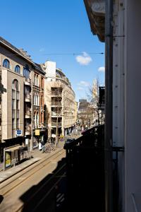 a view of a city street with buildings at Luxury Suites Princess in Antwerp