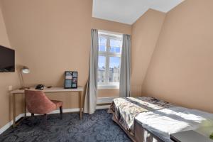 TV a/nebo společenská místnost v ubytování Home Hotel Gabelshus