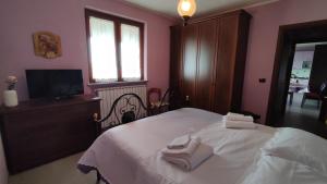 Ένα ή περισσότερα κρεβάτια σε δωμάτιο στο Cottage Chiera