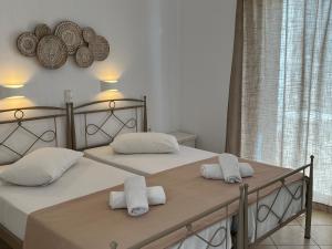 Postel nebo postele na pokoji v ubytování Hotel Chrisoula