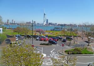 a parking lot with cars parked in a parking lot at Waterfront Quay in Gosport