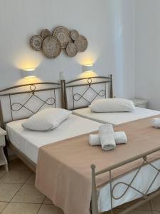 Postel nebo postele na pokoji v ubytování Hotel Chrisoula