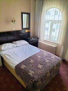 Postel nebo postele na pokoji v ubytování SPOR HOTEL