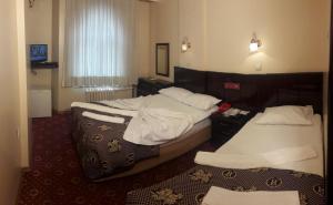 Postel nebo postele na pokoji v ubytování SPOR HOTEL