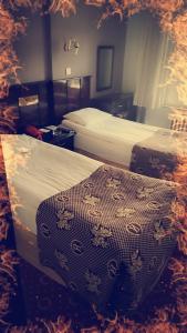 Postel nebo postele na pokoji v ubytování SPOR HOTEL
