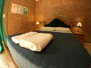 Ліжко або ліжка в номері Apart Conector Sur