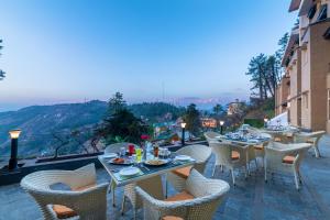 A restaurant or other place to eat at Summit Naldehra Grand Resort & Spa