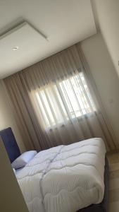 Voodi või voodid majutusasutuse Apar hôtel 2 chambres neuf toas +2 fotot