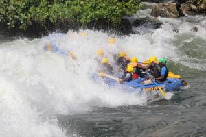 a group of people in a raft in a river at Igwe Homes - Kisaasi in Kampala