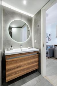 a bathroom with a sink and a mirror at THYME Brand New 1BD apart in the heart of Rethymno in Rethymno