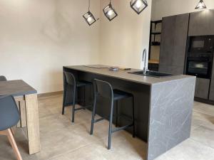 Kuchyň nebo kuchyňský kout v ubytování Home Paradise