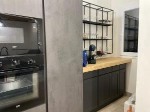 Kuchyň nebo kuchyňský kout v ubytování Home Paradise