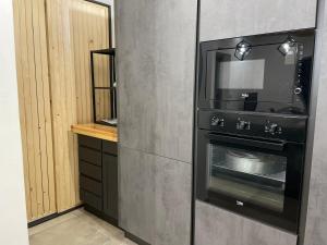 Kuchyň nebo kuchyňský kout v ubytování Home Paradise