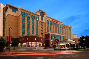 a hotel building on a city street at night at Marriott Bloomington Normal Hotel and Conference Center in Bloomington