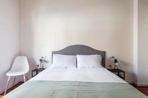 Postel nebo postele na pokoji v ubytování 7P céntrico piso con encanto