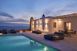 a villa with a swimming pool at night at Annez Villa with Private Pool Panoramic Sea View in Mýkonos City