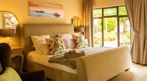 Ένα ή περισσότερα κρεβάτια σε δωμάτιο στο 2 On Lismore Guesthouse +158 φωτογραφίες