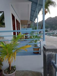 a house with plants on the side of it at Chislyk Inn in El Nido