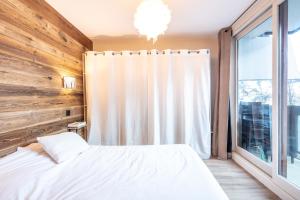 Posteľ alebo postele v izbe v ubytovaní La Pirouette - Appt pour 8 vue sur piste