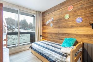 Posteľ alebo postele v izbe v ubytovaní La Pirouette - Appt pour 8 vue sur piste