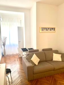 a living room with a couch and a table at Pariolina in Rome