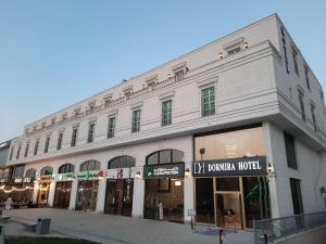 a large white building on a city street at دورميرا البوليفارد in Riyadh