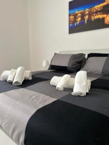 two beds with white pillows on top of them at Palmira's Rome Sweet Home in Rome