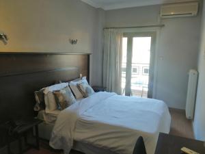 A bed or beds in a room at Liknon