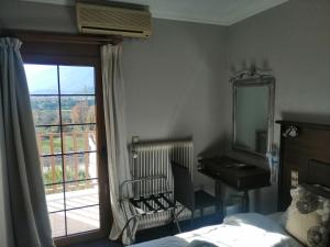 A bed or beds in a room at Liknon