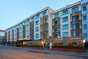 a large building on the side of a street at Dosso Dossi Hotels & SPA Downtown in Istanbul
