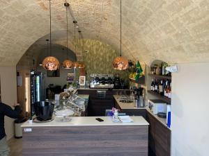 a kitchen with a counter in a room at B&B 62 Marinai in Bari