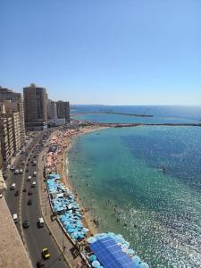 an aerial view of a beach with umbrellas and the ocean at Stunning Sea View Flat (One Bed Room)Entire Place in Alexandria