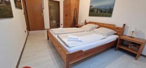 a bedroom with two beds with white sheets at ciao-aschau Gschwendtnerhof Ap21 Kappes in Aschau
